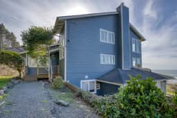 Sunlit home with gorgeous ocean views big decks and hot tub