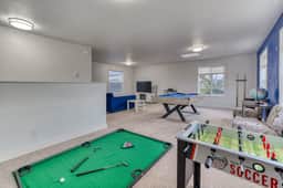 Ocean view home with pool table and fast WiFi steps to beach shops and eateries