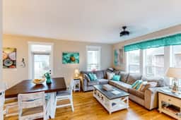 Charming three story getaway with two cozy living areas walk to the beach