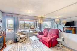 Cozy Coastal Condo Steps from the Beach with Deck Views