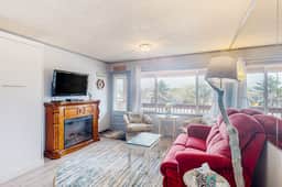 Cozy Coastal Condo Steps from the Beach with Deck Views