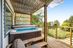 Welcoming Condo with Ocean Views and Private Hot Tub Short Walk to the Beach