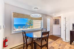 Quaint ocean view escape with modern interior smart TV and gorgeous deck
