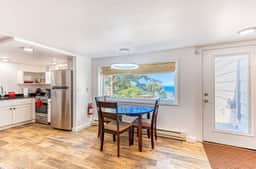 Quaint ocean view escape with modern interior smart TV and gorgeous deck