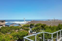 Renovated lake ocean view retreat with hot tub outdoor living and fireplace