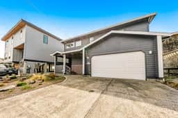 Two story oceanfront retreat with a washer dryer firepit and Ping Pong table