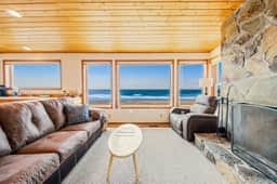 Two story oceanfront retreat with a washer dryer firepit and Ping Pong table