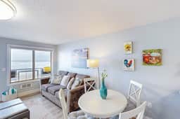 Rock Creek Inn condo on beach with ocean view balcony walk to shops and dining