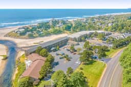 Creekfront Condo with Private Patio Beach Access Shared with D Gas Grill and Views
