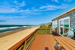 Ocean front home with spacious deck and beach access near shops and restaurants