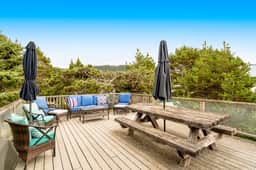 Dog friendly home across street from beach with rooftop deck and views