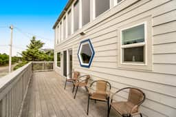 Dog friendly home across street from beach with rooftop deck and views