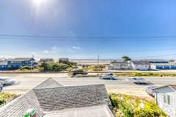 Three story condo with ocean sunset view and game room 500 feet to beach