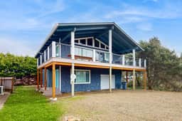 Renovated home near beach access with two kitchens and fireplace dog friendly