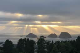 Sweeping ocean view home with fireplace grill and foosball table dog friendly