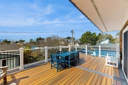 Charming modern home close to the beach with full kitchen WiFi and large deck