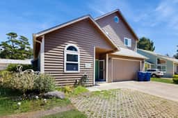 Expansive family friendly home with a private hot tub walk to the beach
