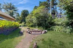 Expansive family friendly home with a private hot tub walk to the beach