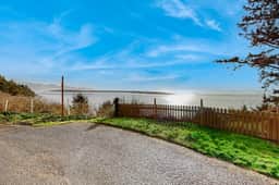 Quaint oceanfront hideaway with open layout fireplace central AC and gas grill