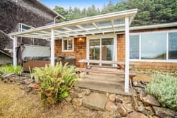 Cozy dog friendly home with ocean views a private hot tub and washer and dryer