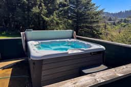 Ocean and lake view home with private hot tub and beach access