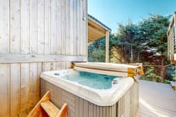Dog Friendly Coastal Retreat with Water Views Deck Private Hot Tub and WiFi