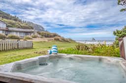 Oceanfront cottage with hot tub beach access fireplace and WiFi Dog friendly
