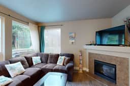 Modern Ocean Highlands home with Netarts Bay and ocean views fireplace dogs OK