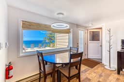 Quaint ocean view escape with modern interior smart TV and gorgeous deck - Image 4