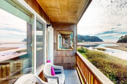 Creekside condo with beach access balcony full kitchen and ocean views - Image 2
