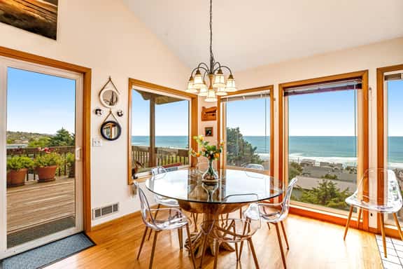 Limited Time Deals Coastal Hideaway with Ocean Views and Spacious Deck - Image 1