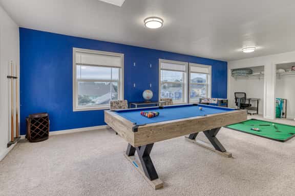 Ocean view home with pool table and fast WiFi steps to beach shops and eateries - Image 1