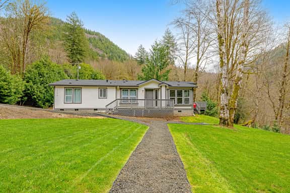 Dog friendly waterfront home on the Wilson River with great views deck and WiFi - Image 1