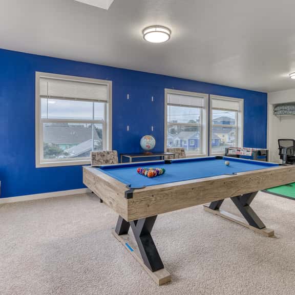 Ocean view home with pool table and fast WiFi steps to beach shops and eateries - Image 1