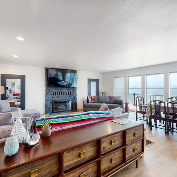 Bayview home with a deck overlooking the locally famous Ghost Hole fishing spot - Image 1