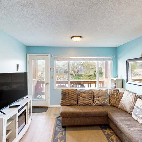 Creekside condo with beach access balcony full kitchen and ocean views - Image 1