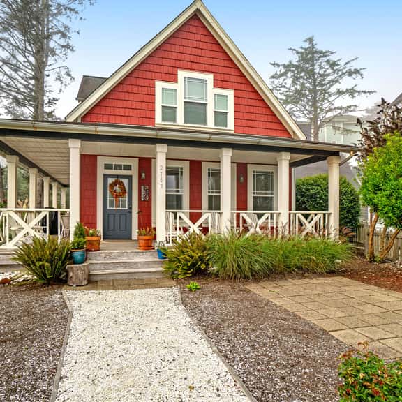 Romantic Oregon Coast Escape with Porch, Fireplace & Garden Charm - Image 1