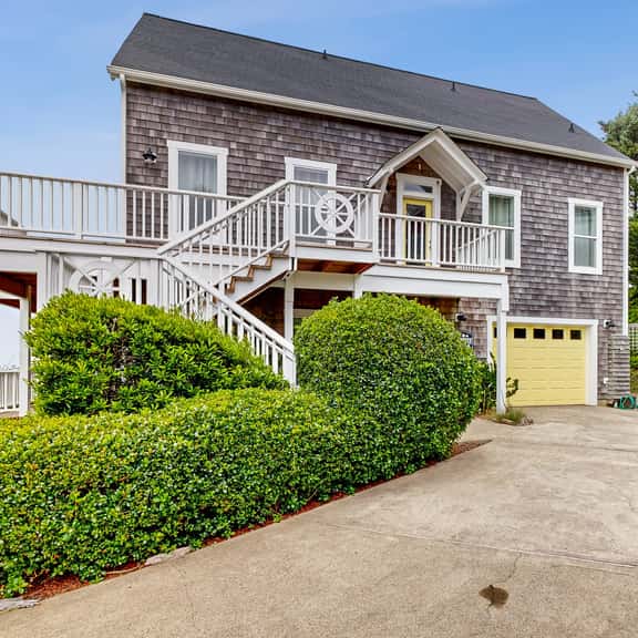 Ocean view home with hot tub game room furnished deck and fireplaces - Image 1