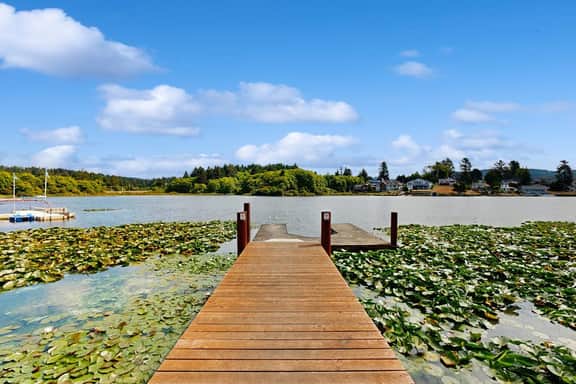 Waterfront home with private hot tub free WiFi firepit and shared dock