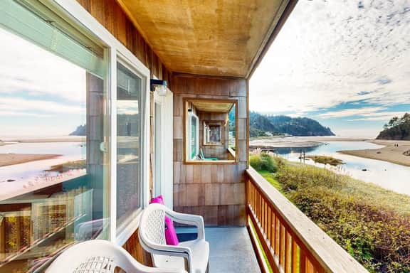 Creekside condo with beach access balcony full kitchen and ocean views