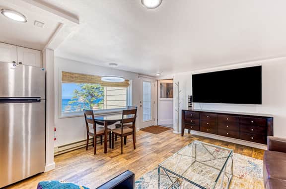 Quaint ocean view escape with modern interior smart TV and gorgeous deck