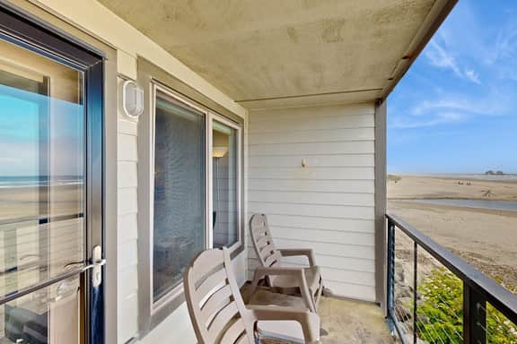Beachfront condo boasting beautiful views a private balcony and perfect location