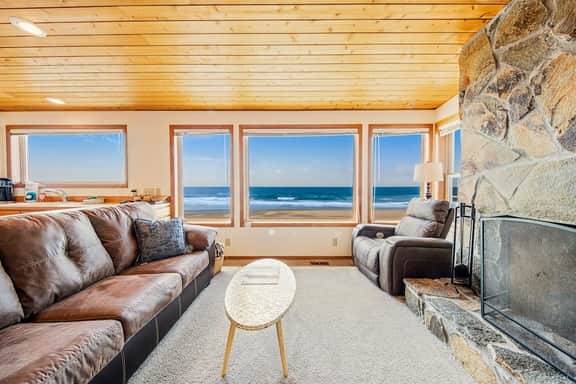 Two story oceanfront retreat with a washer dryer firepit and Ping Pong table