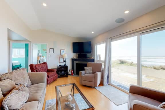 Beachfront home with ocean facing deck and ocean views throughout modern kitchen