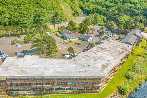 Creekfront Condo with Private Patio Beach Access Shared with D Gas Grill and Views