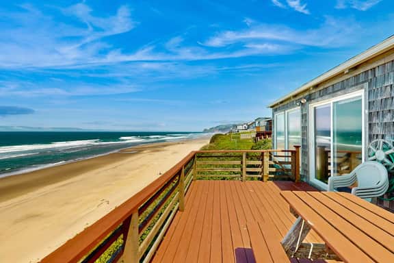 Ocean front home with spacious deck and beach access near shops and restaurants