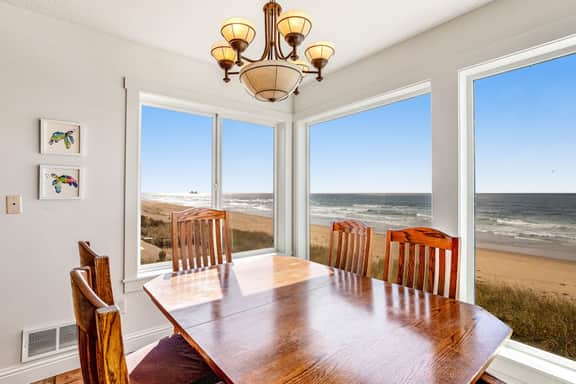 Waterfront dog friendly home a few steps from the beach with hot tub