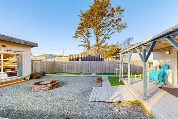 Coastal Paradise Awaits Spacious Retreat with Firepit and Entertainment - Image 5