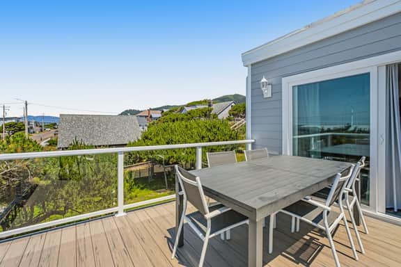 Dog friendly ocean view home with deck and enclosed yard 1 block to beach