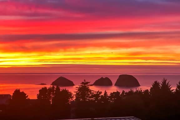 Sweeping ocean view home with fireplace grill and foosball table dog friendly